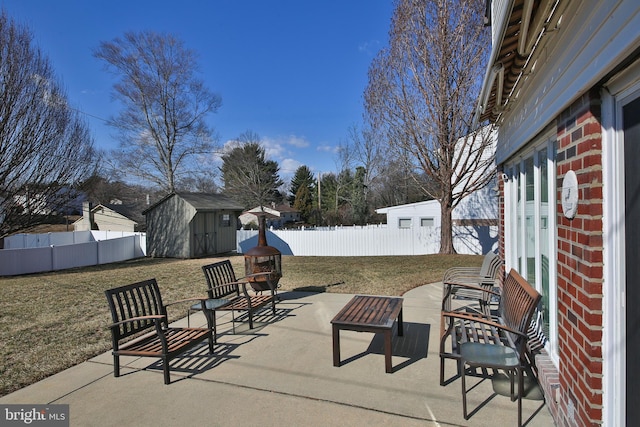 view of patio / terrace featuring a shed, a fenced backyard, and an outdoor structure