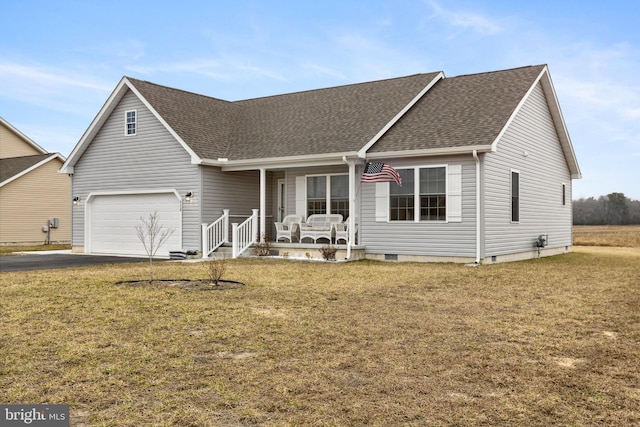 ranch-style house featuring a shingled roof, covered porch, driveway, and a front lawn