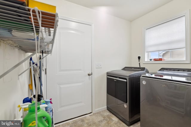 washroom with laundry area and washing machine and dryer