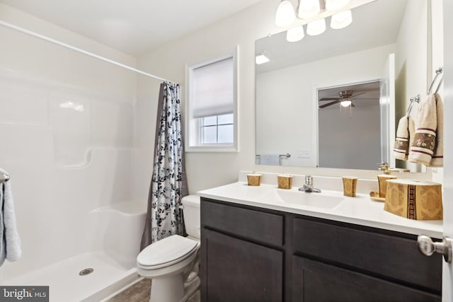 full bath featuring toilet, vanity, and a shower with shower curtain