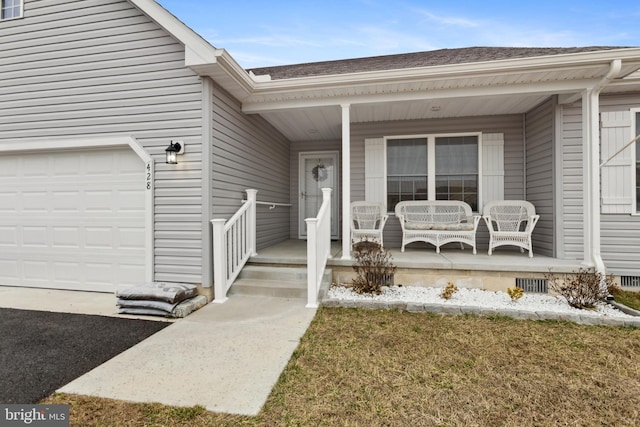 property entrance with a porch, crawl space, and a garage