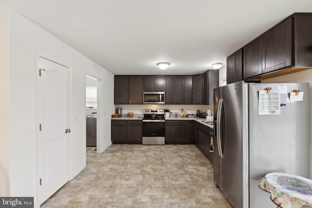 kitchen featuring appliances with stainless steel finishes, washer / clothes dryer, light countertops, and dark brown cabinetry