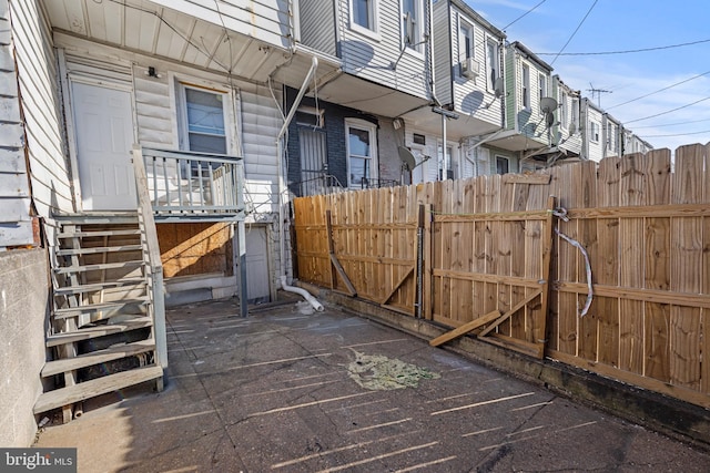 exterior space featuring fence and a gate