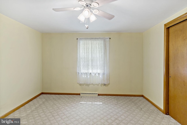 spare room with visible vents, baseboards, and ceiling fan