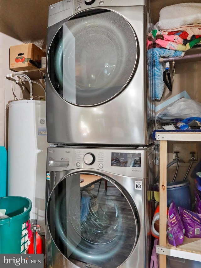 laundry room featuring stacked washer and dryer and laundry area