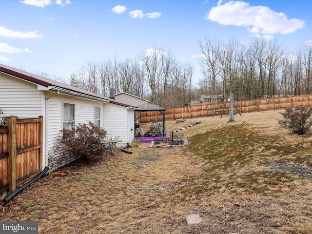 view of yard with a fenced backyard