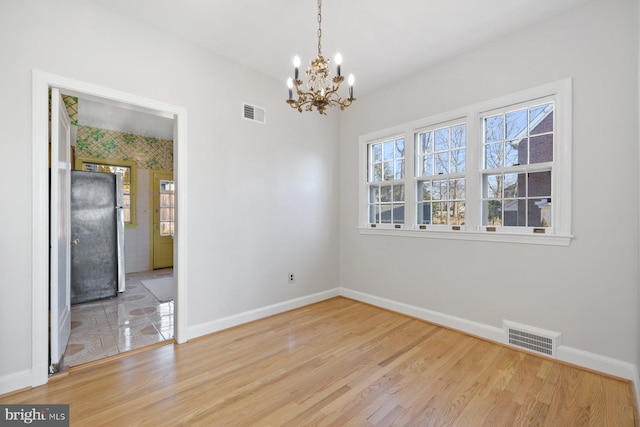 7310 Alaska Ave NW, Washington, DC 20012 - empty room with visible vents, light wood-style flooring, and baseboards