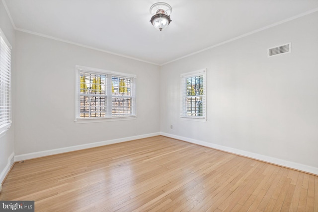 7310 Alaska Ave NW, Washington, DC 20012 - spare room with ornamental molding, light wood-style flooring, visible vents, and baseboards