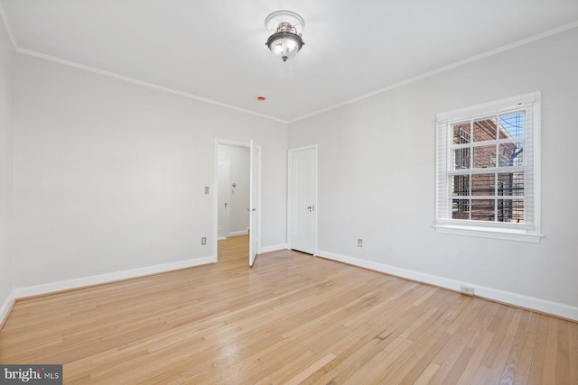 7310 Alaska Ave NW, Washington, DC 20012 - empty room featuring light wood-type flooring, baseboards, and crown molding