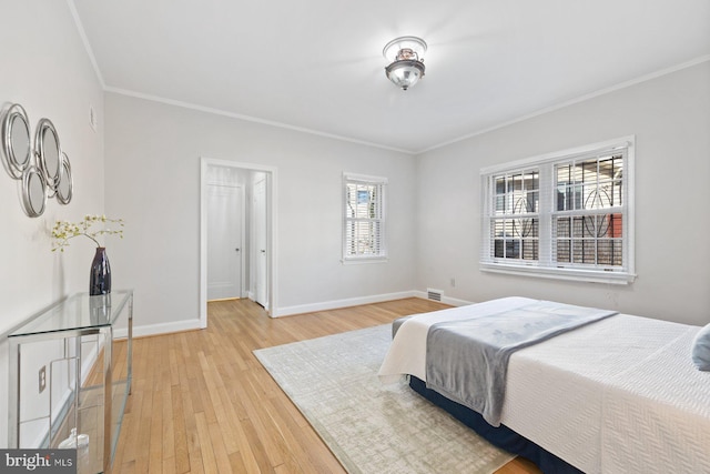 7310 Alaska Ave NW, Washington, DC 20012 - bedroom with light wood finished floors, visible vents, baseboards, and crown molding