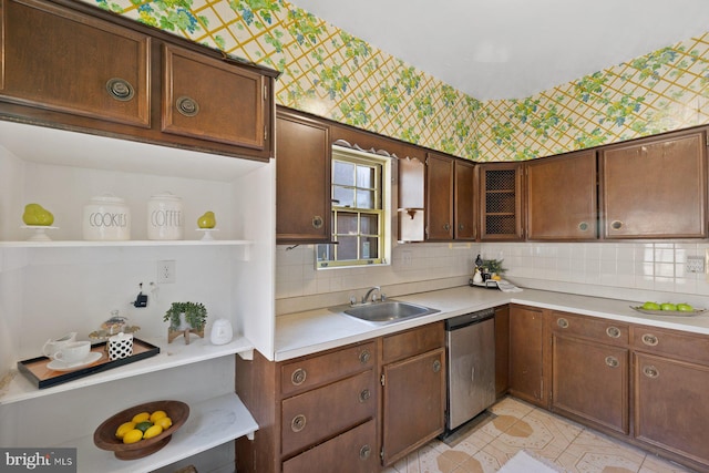 7310 Alaska Ave NW, Washington, DC 20012 - kitchen featuring light countertops, a sink, backsplash, and stainless steel dishwasher