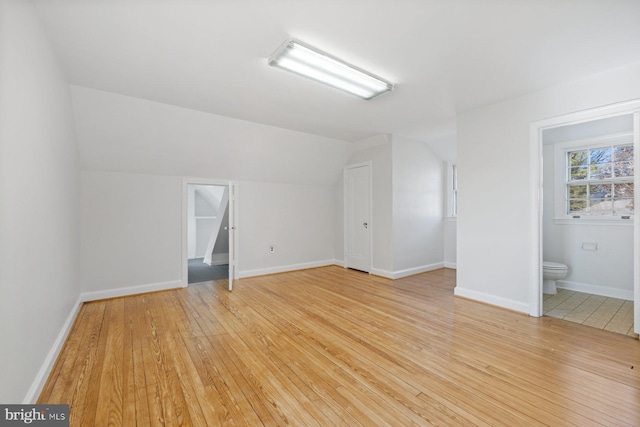 7310 Alaska Ave NW, Washington, DC 20012 - additional living space featuring lofted ceiling, light wood finished floors, and baseboards