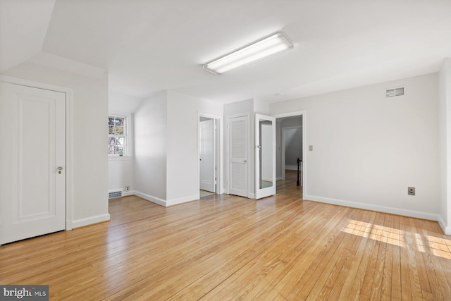 7310 Alaska Ave NW, Washington, DC 20012 - interior space featuring light wood-type flooring, visible vents, and baseboards