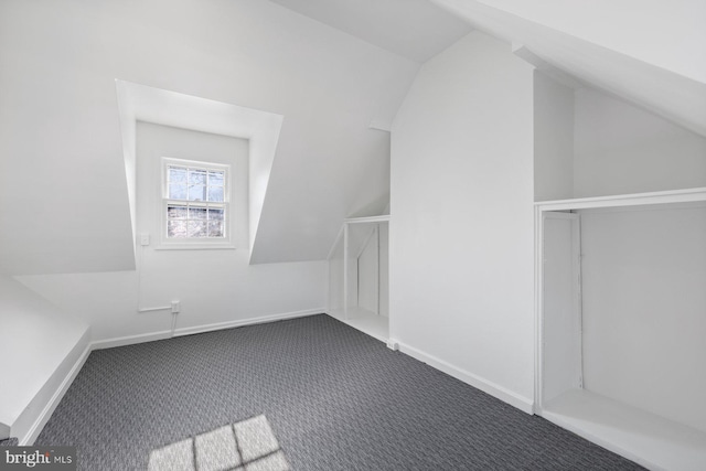 7310 Alaska Ave NW, Washington, DC 20012 - bonus room featuring lofted ceiling, baseboards, and dark carpet