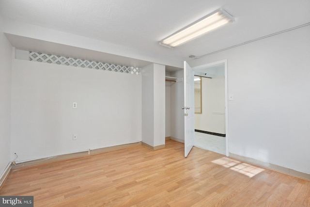 7310 Alaska Ave NW, Washington, DC 20012 - unfurnished bedroom with a closet and light wood-type flooring