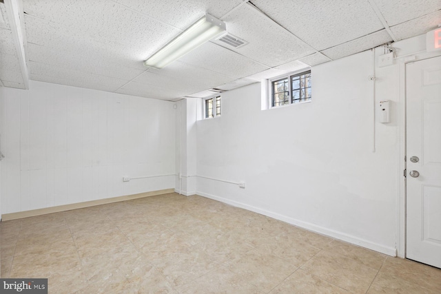 7310 Alaska Ave NW, Washington, DC 20012 - basement with a paneled ceiling, visible vents, and baseboards