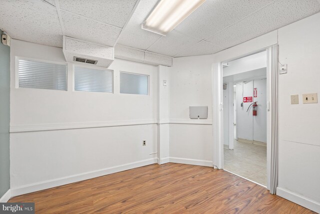 7310 Alaska Ave NW, Washington, DC 20012 - spare room featuring visible vents, wood finished floors, a paneled ceiling, and baseboards