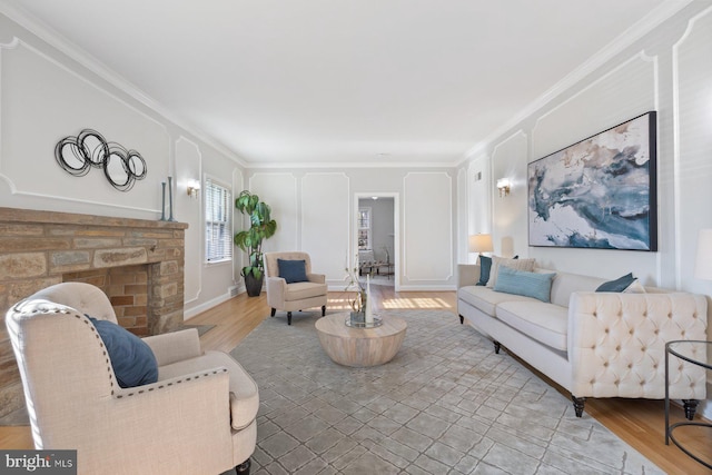 7310 Alaska Ave NW, Washington, DC 20012 - living area featuring light wood-type flooring, a fireplace, and crown molding
