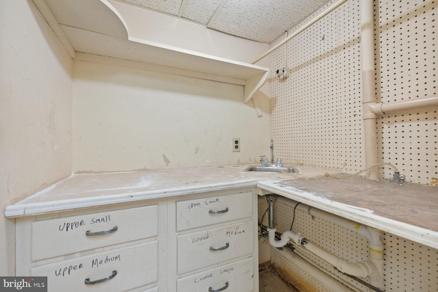 7310 Alaska Ave NW, Washington, DC 20012 - kitchen with light countertops, a sink, and open shelves