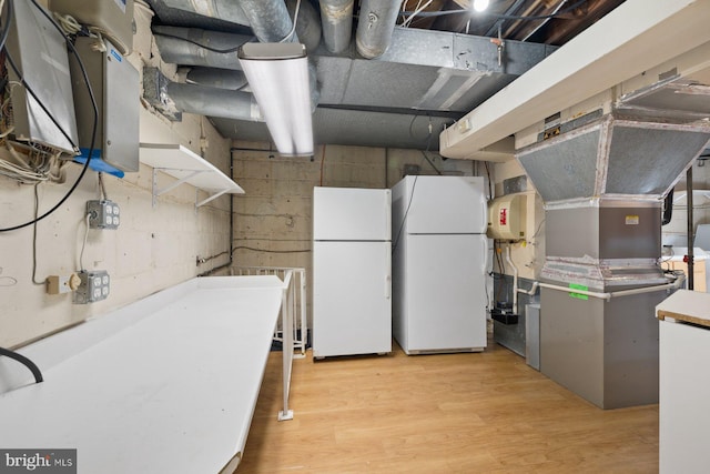 7310 Alaska Ave NW, Washington, DC 20012 - kitchen featuring light wood-type flooring, freestanding refrigerator, and light countertops