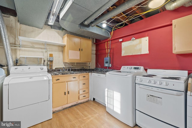 7310 Alaska Ave NW, Washington, DC 20012 - laundry room featuring separate washer and dryer, a sink, and light wood-style floors