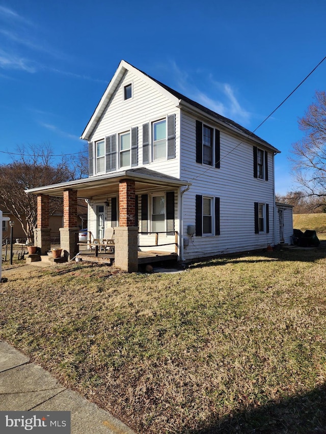 view of front of house featuring a front lawn and a porch