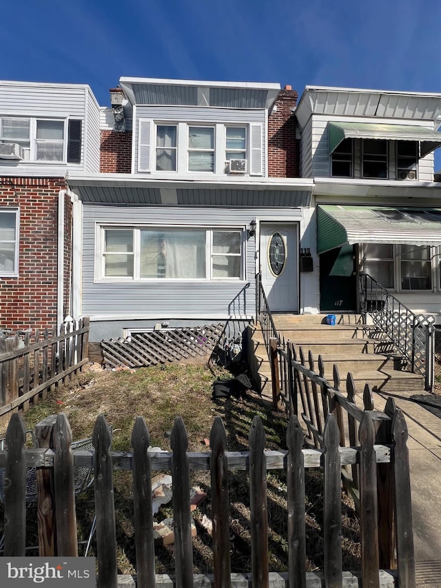 view of property with fence