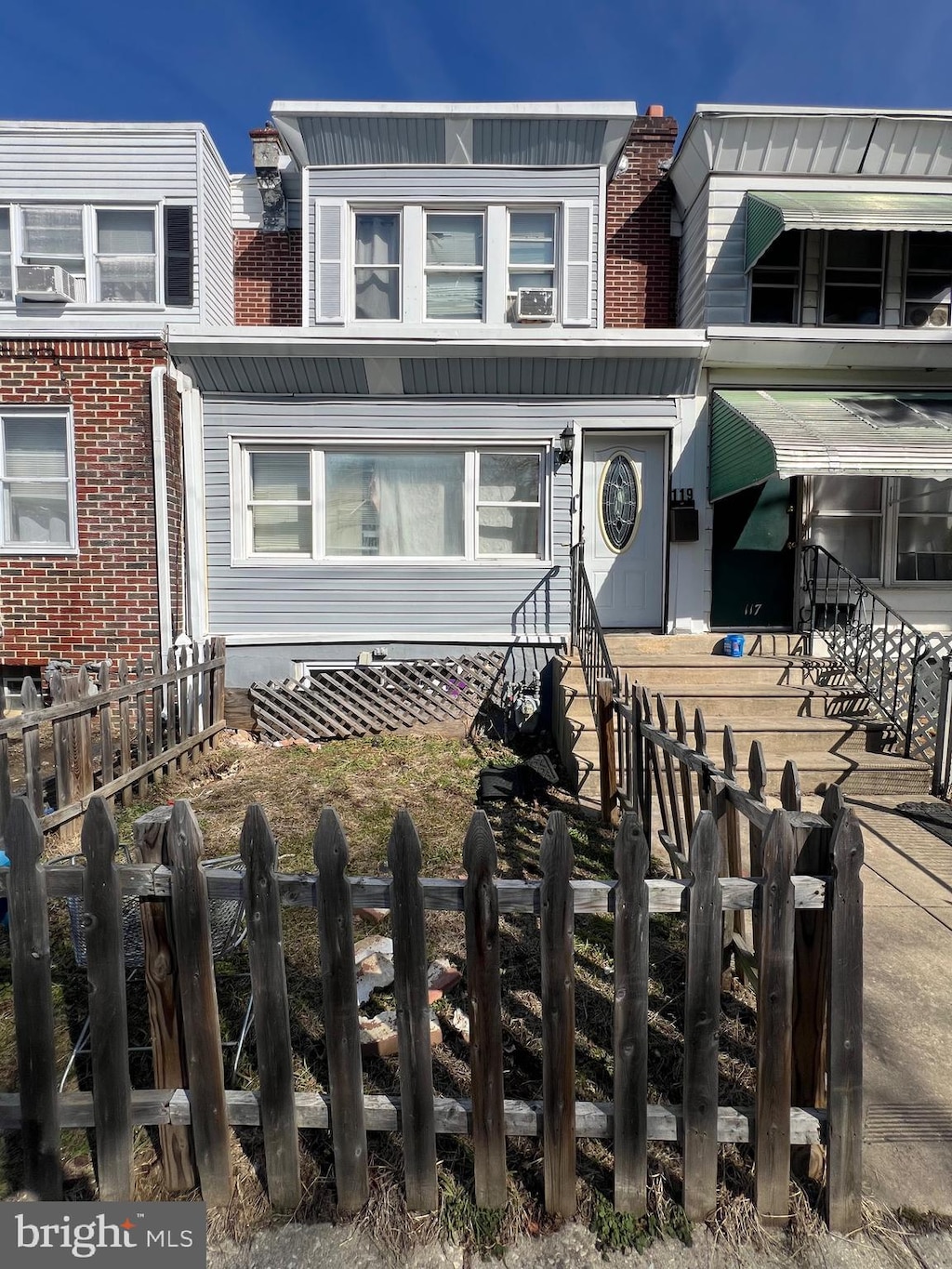 view of property with fence