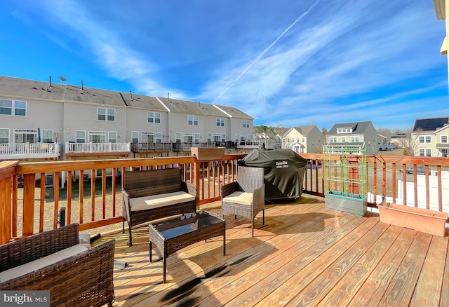 deck featuring a residential view, outdoor lounge area, and area for grilling