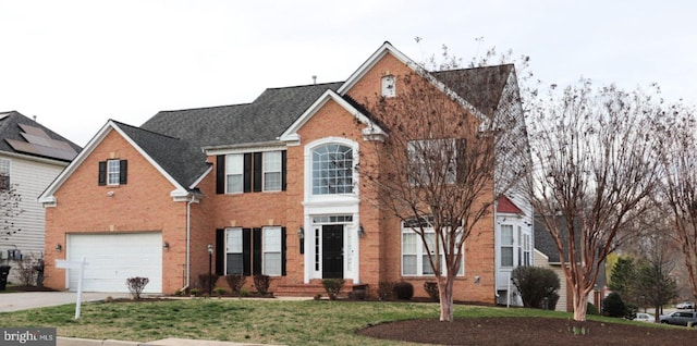 210 Potomac Ridge Dr, Fort Washington, MD 20744 - colonial home featuring a garage, brick siding, concrete driveway, and a front yard