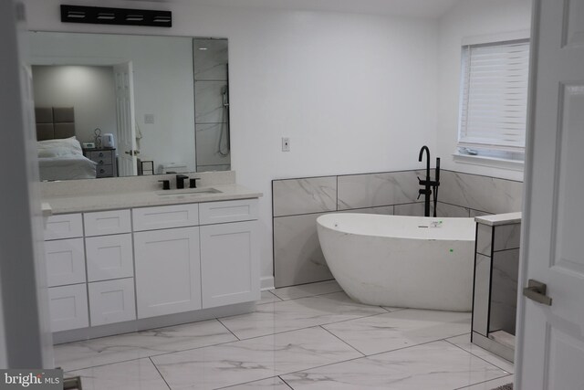 210 Potomac Ridge Dr, Fort Washington, MD 20744 - full bath featuring vanity, a soaking tub, ensuite bathroom, tile walls, and marble finish floor