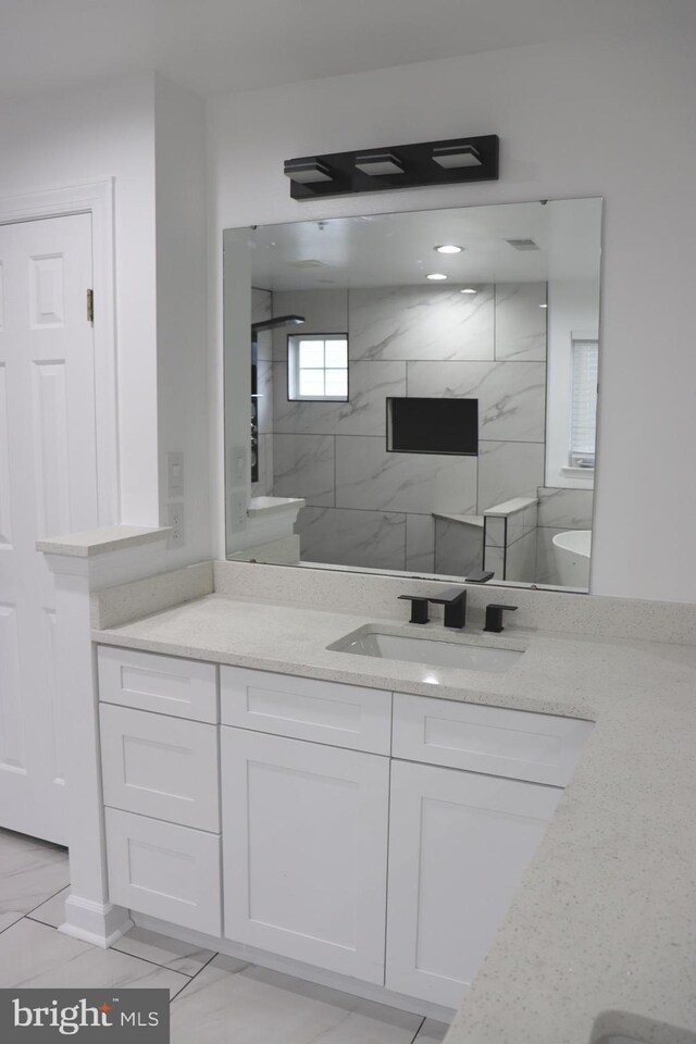 210 Potomac Ridge Dr, Fort Washington, MD 20744 - bathroom with a marble finish shower, marble finish floor, and vanity