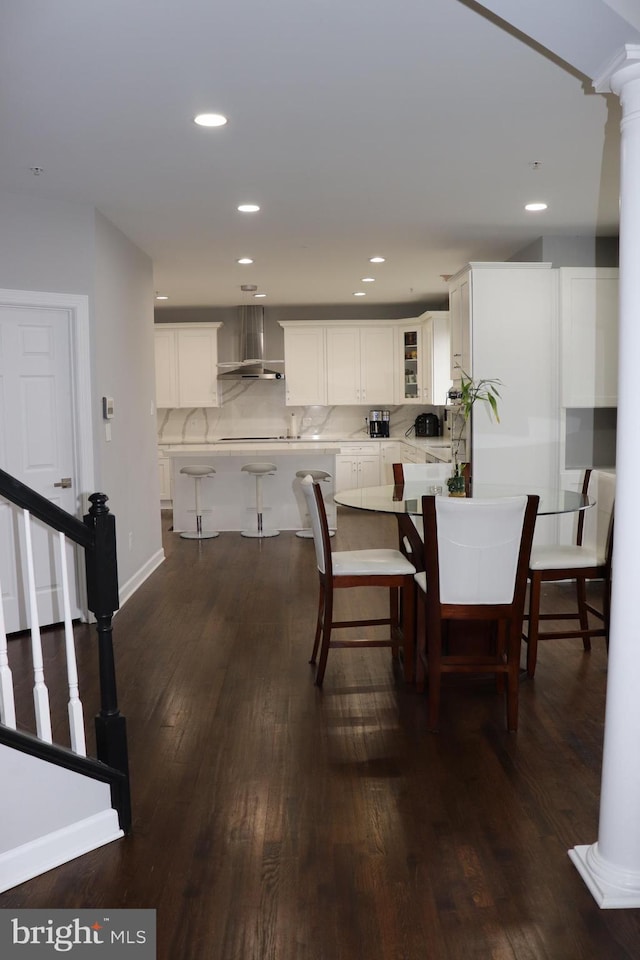 210 Potomac Ridge Dr, Fort Washington, MD 20744 - dining area featuring baseboards, dark wood finished floors, stairway, recessed lighting, and ornate columns