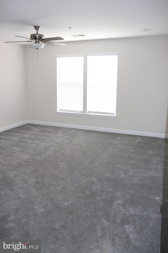 210 Potomac Ridge Dr, Fort Washington, MD 20744 - spare room featuring visible vents, dark carpet, baseboards, and a ceiling fan