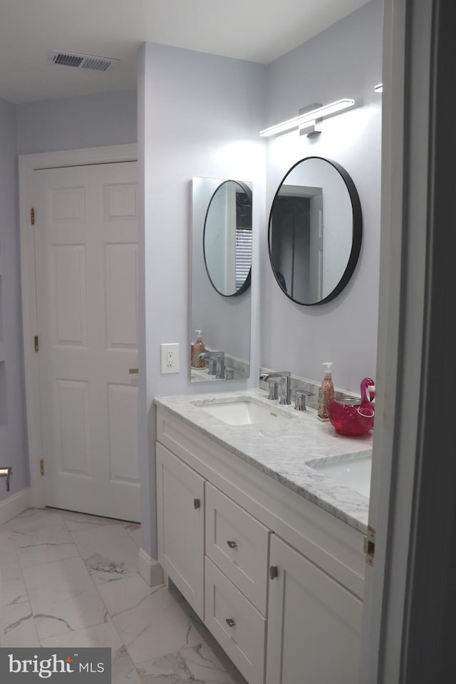 210 Potomac Ridge Dr, Fort Washington, MD 20744 - bathroom featuring visible vents, baseboards, marble finish floor, and vanity