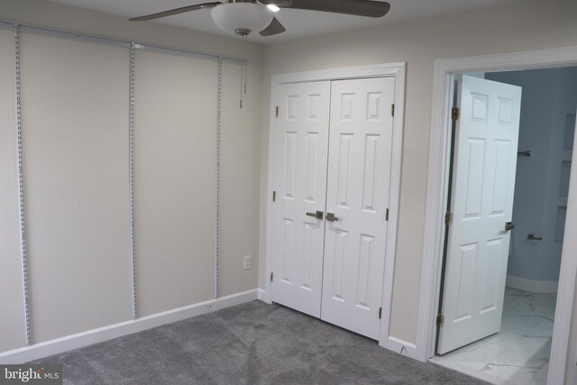 210 Potomac Ridge Dr, Fort Washington, MD 20744 - unfurnished bedroom featuring a closet, marble finish floor, a ceiling fan, and baseboards