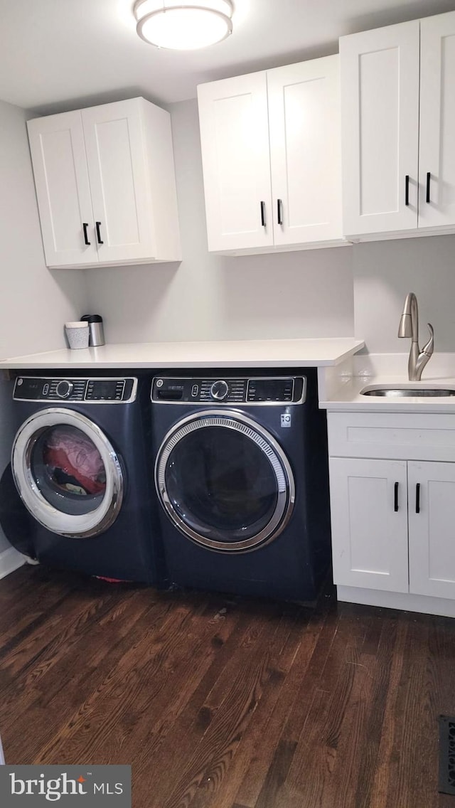 210 Potomac Ridge Dr, Fort Washington, MD 20744 - laundry area with dark wood finished floors, cabinet space, separate washer and dryer, and a sink