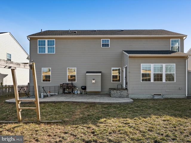 rear view of property featuring a patio area
