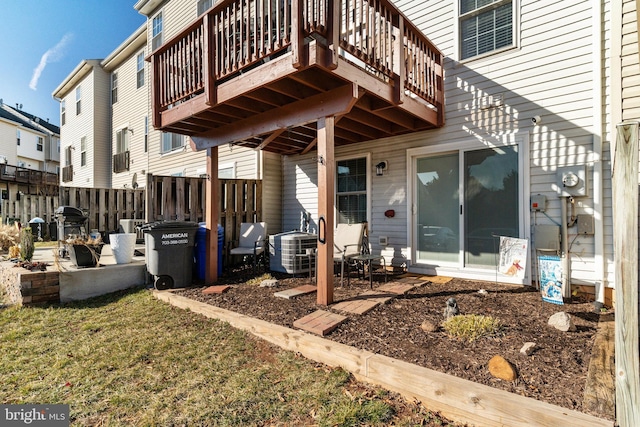 exterior space featuring cooling unit and fence