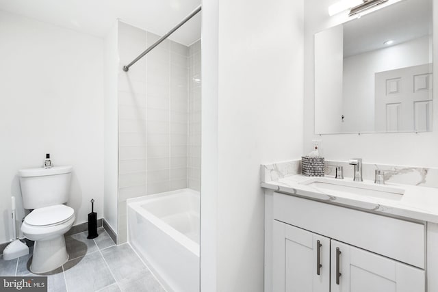 bathroom with tile patterned flooring, toilet, vanity, baseboards, and tub / shower combination