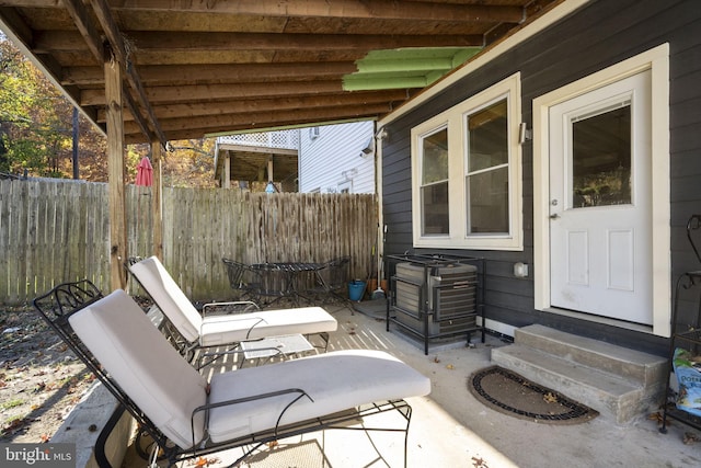 view of patio / terrace with entry steps and fence