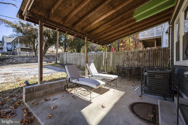 view of patio / terrace with central AC and a fenced backyard