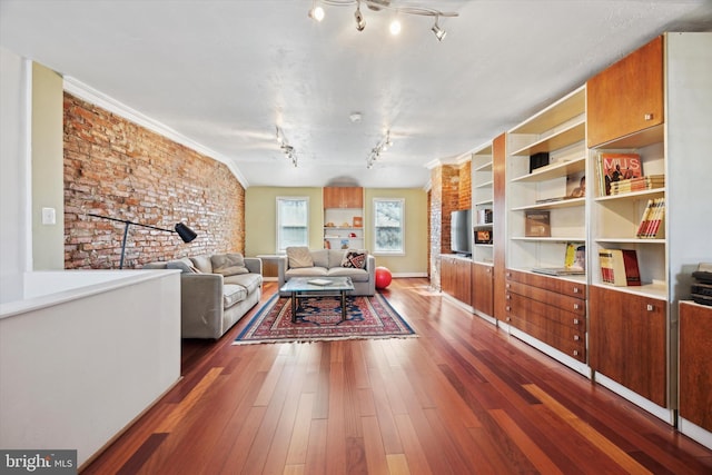 living room with dark wood finished floors and track lighting