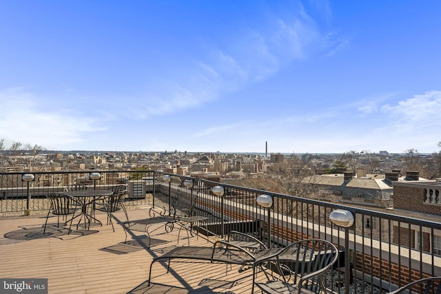 wooden terrace with a view of city