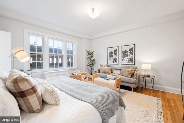 bedroom featuring light wood-style flooring and baseboards