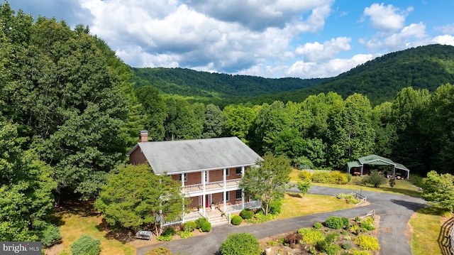 bird's eye view with a mountain view and a wooded view