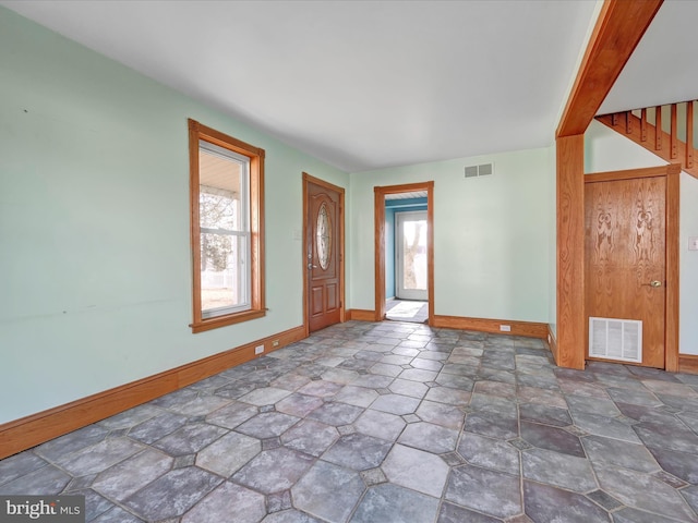 entryway with visible vents and baseboards