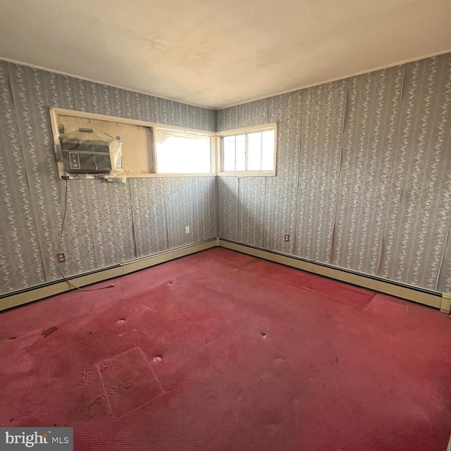 carpeted empty room featuring wallpapered walls