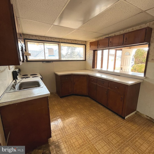 kitchen with a wealth of natural light, light countertops, and light floors