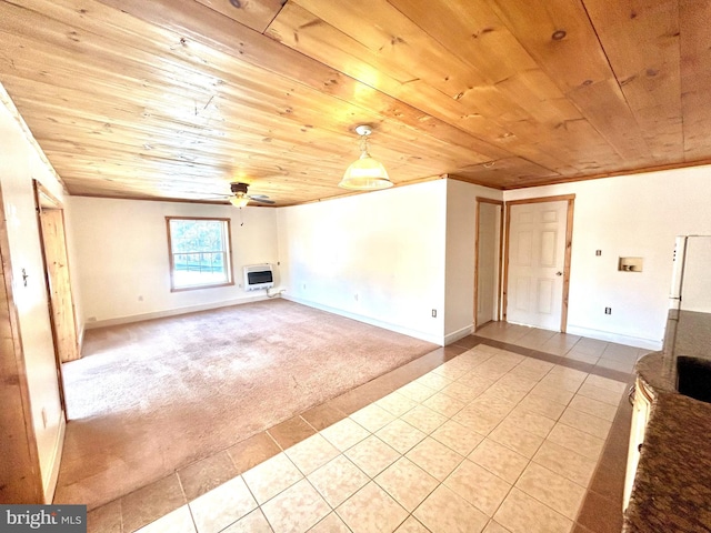 unfurnished living room featuring wooden ceiling, heating unit, a ceiling fan, and light colored carpet